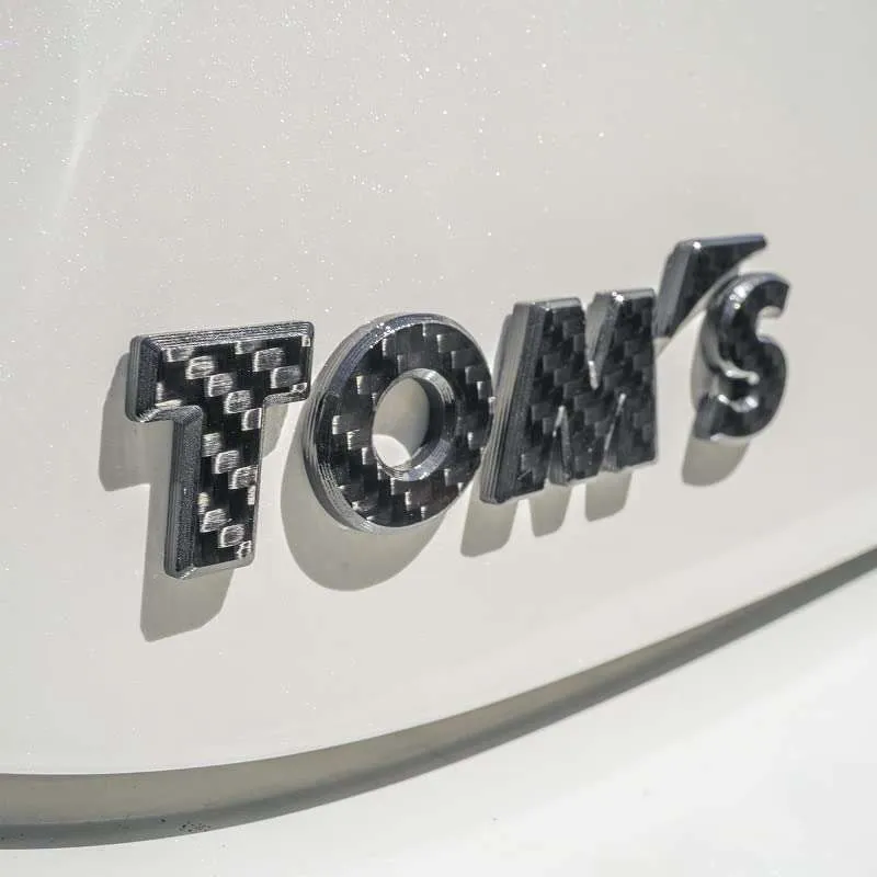 Tom's Racing Parts TOM'S Racing Emblem Gloss Carbon | First Gear Project